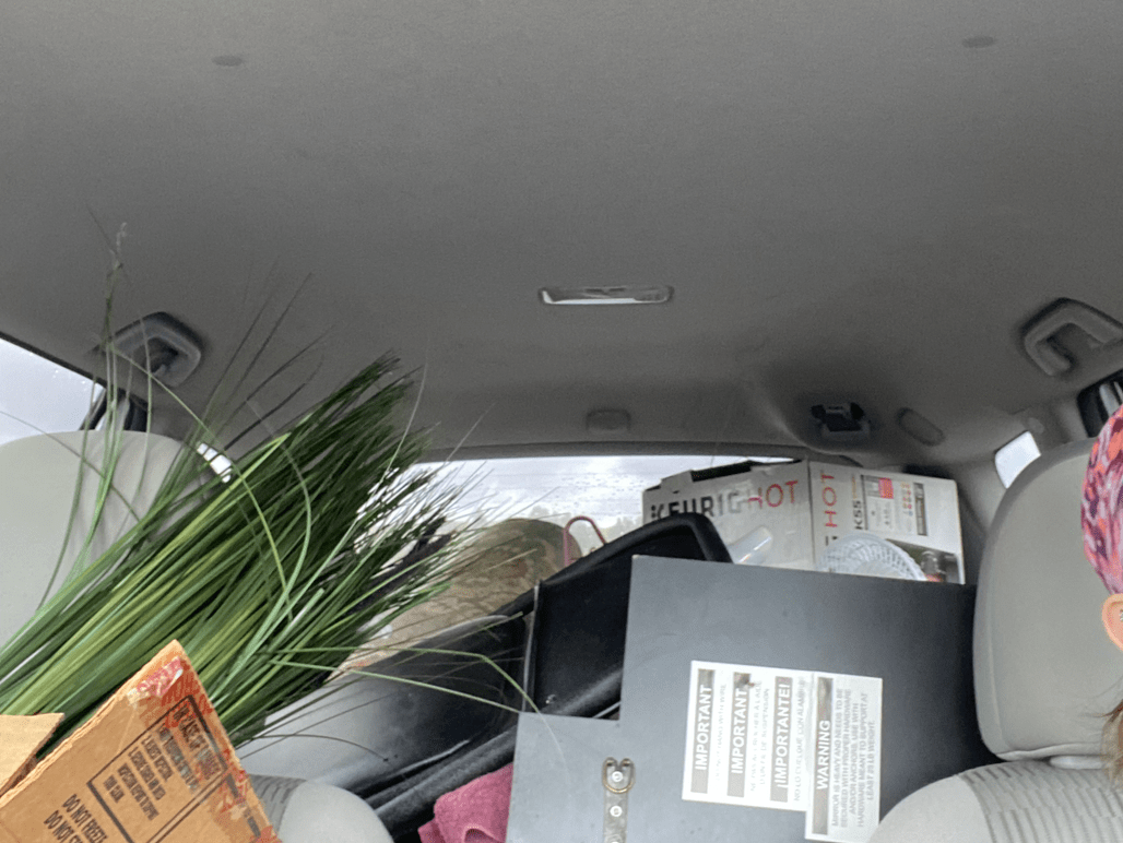 backseat of car with office supplies