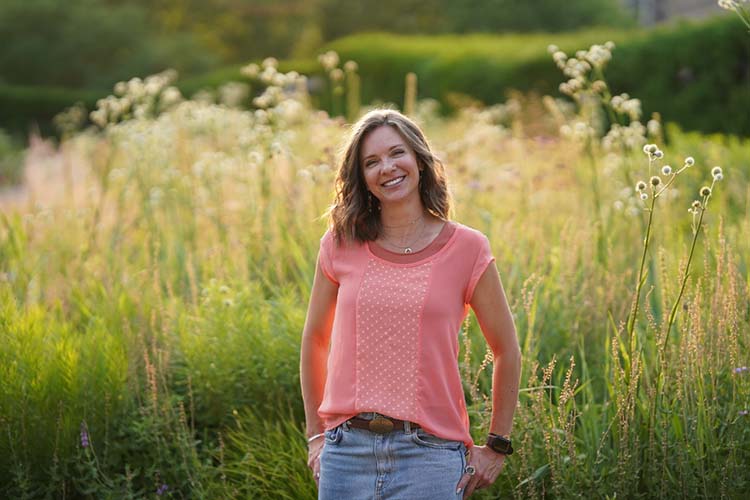 Bethany Colaprete – EdS, NCC, LPC/LMHC outside with flowers