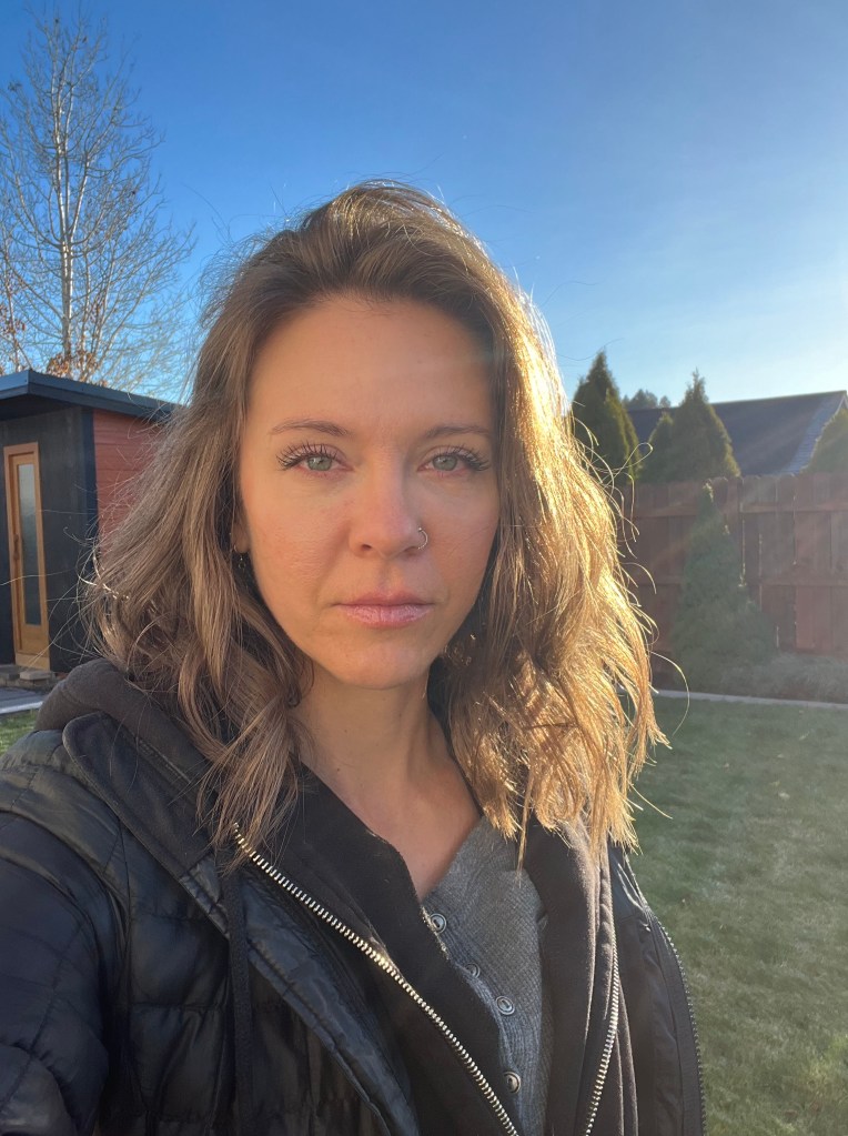 Bethany Colaprete therapist and coach outside.